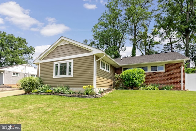 7407 Falmouth St, Springfield, VA 22150 - view of front facade featuring a front yard and brick siding