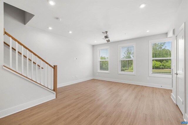 678 Noush Ct Unit A, Charlottesville, VA 22911 - unfurnished living room with stairs, plenty of natural light, light wood finished floors, and recessed lighting