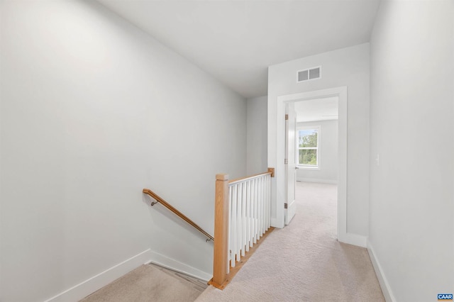 678 Noush Ct Unit A, Charlottesville, VA 22911 - hall featuring an upstairs landing, baseboards, and light carpet