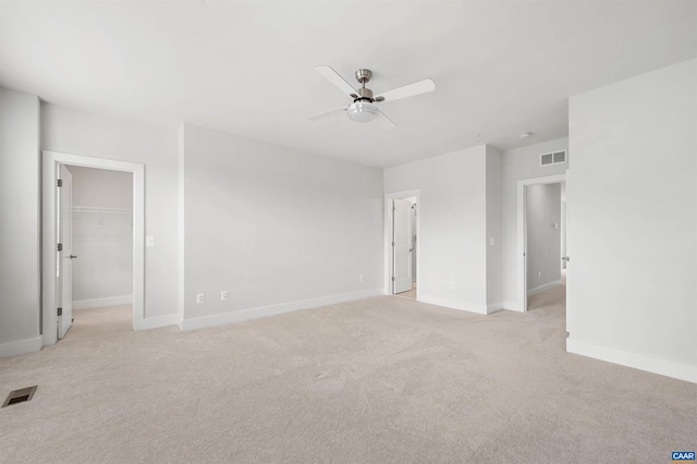 678 Noush Ct Unit A, Charlottesville, VA 22911 - empty room featuring a ceiling fan, light colored carpet, and baseboards