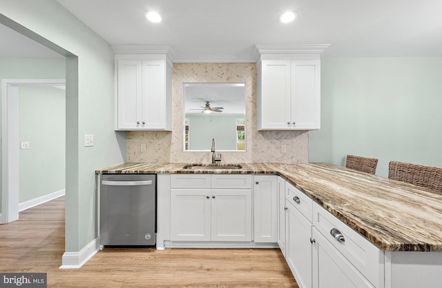 12542 Torquay Rd, Ocean City, MD 21842 - kitchen with dishwasher, a sink, backsplash, white cabinets, and recessed lighting