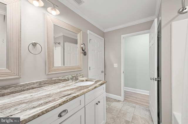 12542 Torquay Rd, Ocean City, MD 21842 - bathroom with vanity, baseboards, and crown molding
