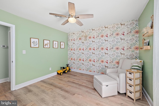 12542 Torquay Rd, Ocean City, MD 21842 - sitting room featuring a ceiling fan, wood finished floors, and baseboards