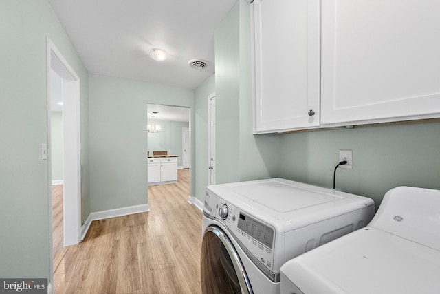12542 Torquay Rd, Ocean City, MD 21842 - laundry room featuring washing machine and clothes dryer, cabinet space, light wood-style flooring, and baseboards