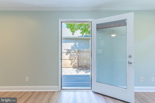 12542 Torquay Rd, Ocean City, MD 21842 - doorway with wood finished floors, crown molding, and baseboards
