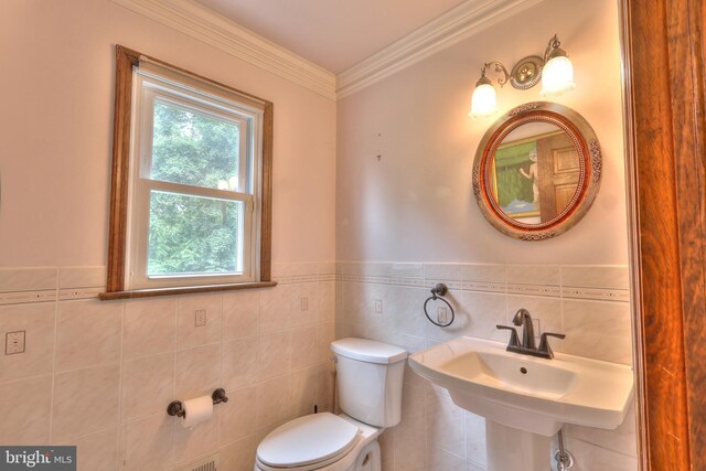 1 Willow Brook Ln, Annandale, NJ 08801 - half bathroom featuring tile walls, toilet, wainscoting, crown molding, and a sink