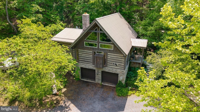 349 Covalt Rd, Needmore, PA 17238 - view of front of home with a garage, a chimney, metal roof, and stone siding