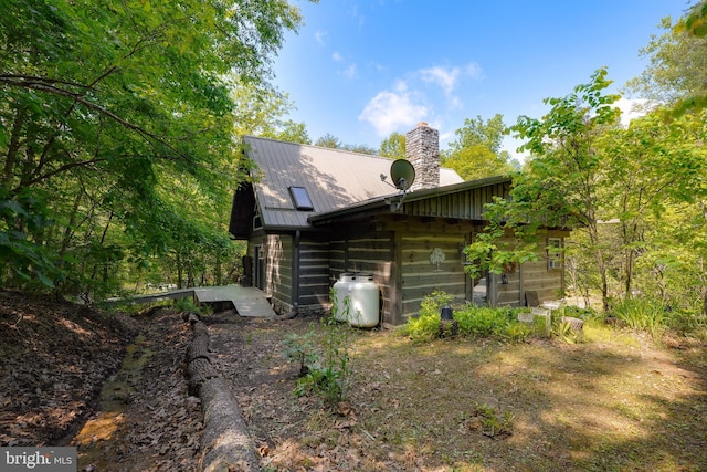 349 Covalt Rd, Needmore, PA 17238 - view of side of home with a chimney and metal roof