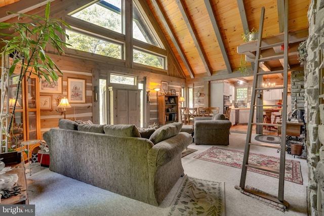 349 Covalt Rd, Needmore, PA 17238 - carpeted living room featuring high vaulted ceiling, wooden walls, and wooden ceiling with exposed beams