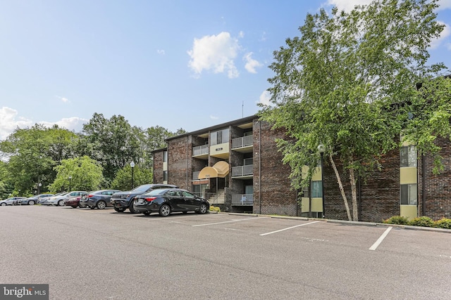 7810 Hanover Pkwy Unit 336, Greenbelt, MD 20770 - view of building exterior featuring uncovered parking