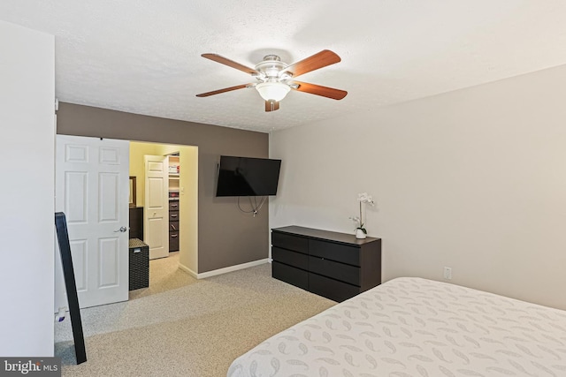 7810 Hanover Pkwy Unit 336, Greenbelt, MD 20770 - bedroom with carpet flooring, baseboards, a walk in closet, and ceiling fan