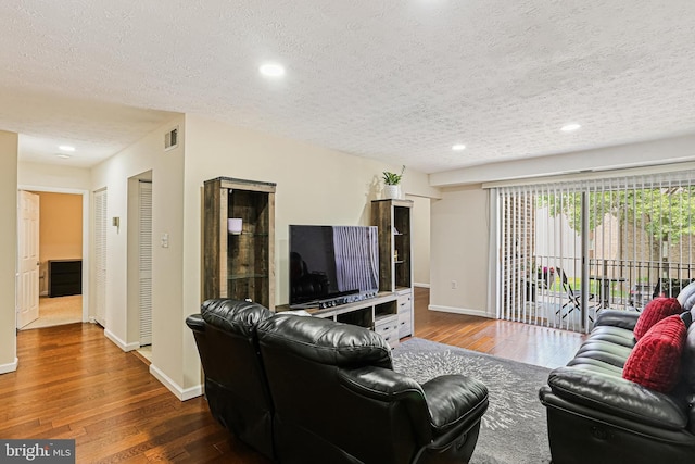 7810 Hanover Pkwy Unit 336, Greenbelt, MD 20770 - living room with a textured ceiling, hardwood / wood-style floors, baseboards, and recessed lighting
