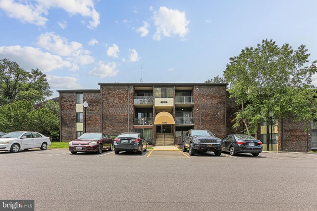 7810 Hanover Pkwy Unit 336, Greenbelt, MD 20770 - view of building exterior with uncovered parking