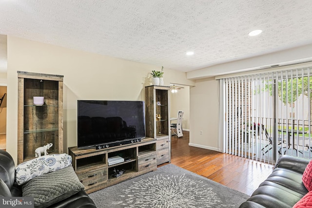 7810 Hanover Pkwy Unit 336, Greenbelt, MD 20770 - living area with wood finished floors, a textured ceiling, recessed lighting, and baseboards