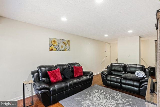 7810 Hanover Pkwy Unit 336, Greenbelt, MD 20770 - living room with wood finished floors, recessed lighting, baseboards, and a textured ceiling