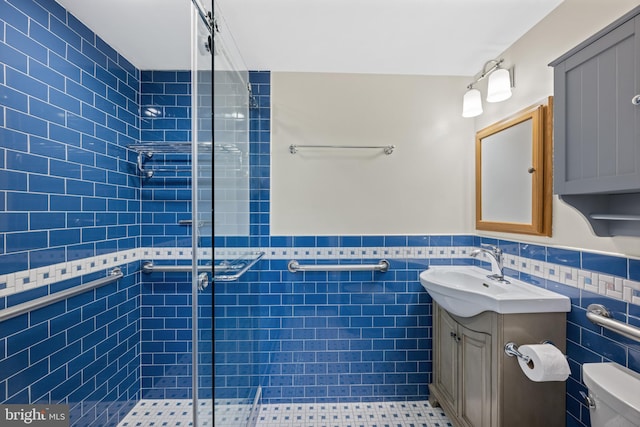 3701 Connecticut Ave NW Unit 312/326, Washington, DC 20008 - bathroom with a shower stall, vanity, toilet, tile walls, and wainscoting