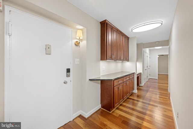 3701 Connecticut Ave NW Unit 312/326, Washington, DC 20008 - hallway featuring light wood finished floors and baseboards