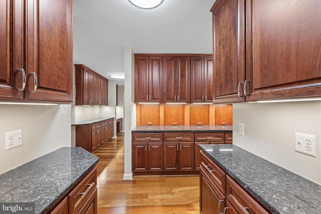 3701 Connecticut Ave NW Unit 312/326, Washington, DC 20008 - kitchen featuring light wood-style flooring and dark stone countertops