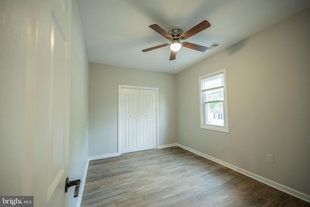 511 S Kent St, Winchester, VA 22601 - unfurnished bedroom with a closet, wood finished floors, baseboards, and a ceiling fan