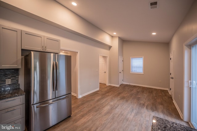 511 S Kent St, Winchester, VA 22601 - kitchen with freestanding refrigerator, gray cabinets, dark stone counters, dark wood finished floors, and recessed lighting