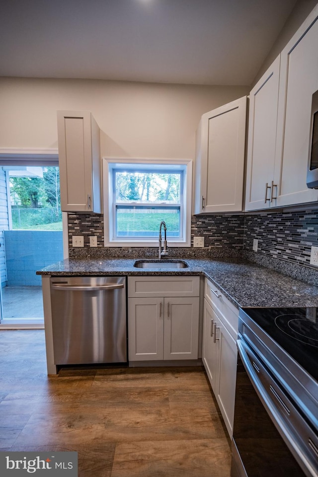 511 S Kent St, Winchester, VA 22601 - kitchen with dishwasher, a sink, decorative backsplash, electric range oven, and wood finished floors