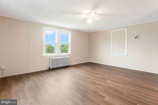 208 W N St, Waynesboro, PA 17268 - empty room featuring radiator heating unit, wood finished floors, and ceiling fan