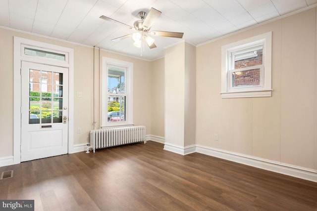 208 W N St, Waynesboro, PA 17268 - empty room featuring radiator, plenty of natural light, crown molding, wood finished floors, and a ceiling fan