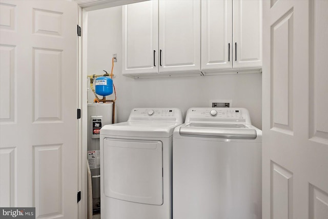 214 October Glory Ave Unit 214G, Ocean View, DE 19970 - laundry area with independent washer and dryer, water heater, and cabinet space