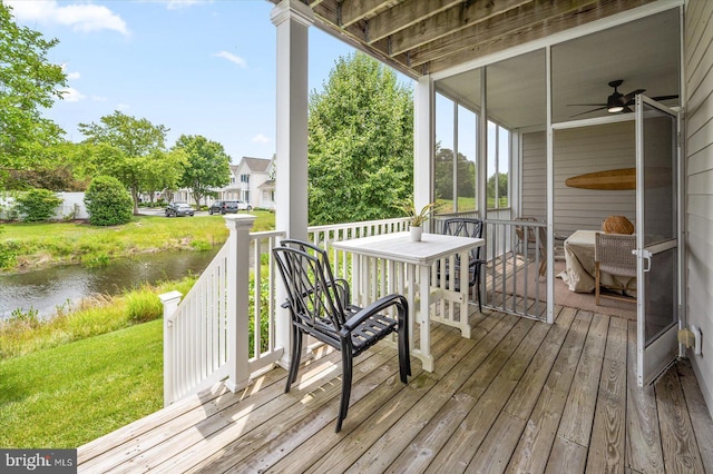 214 October Glory Ave Unit 214G, Ocean View, DE 19970 - wooden terrace featuring a water view, a yard, and ceiling fan