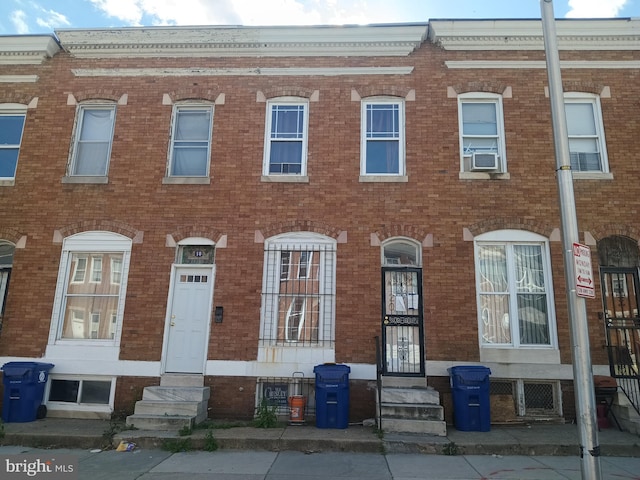 20 N Bentalou St, Baltimore, MD 21223 - townhome / multi-family property featuring entry steps, brick siding, and cooling unit