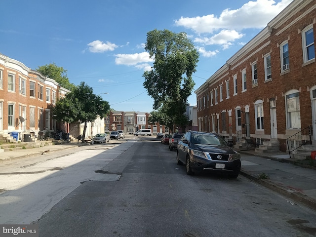 20 N Bentalou St, Baltimore, MD 21223 - view of asphalt road featuring sidewalks, entry steps, street lights, and curbs