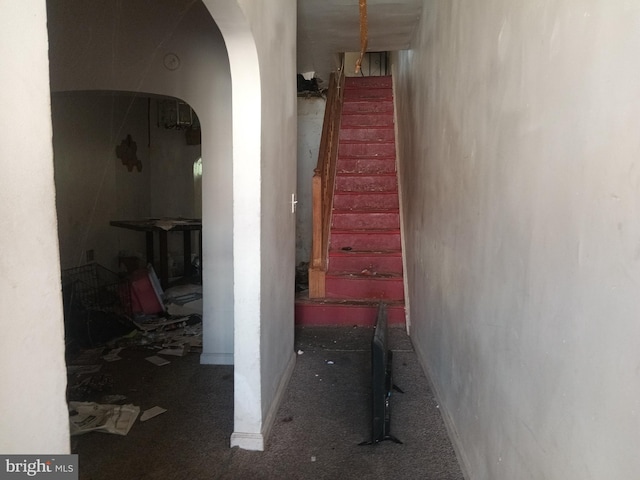 20 N Bentalou St, Baltimore, MD 21223 - corridor featuring arched walkways, stairway, and carpet floors