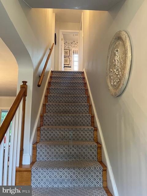 4212 Ingomar St NW, Washington, DC 20015 - staircase with wood finished floors and baseboards