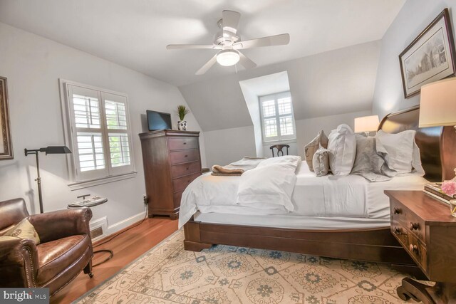 4212 Ingomar St NW, Washington, DC 20015 - bedroom featuring multiple windows, lofted ceiling, wood finished floors, ceiling fan, and baseboards