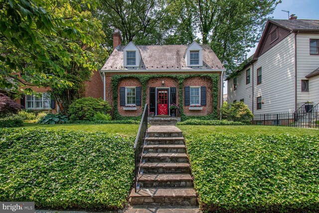 4212 Ingomar St NW, Washington, DC 20015 - view of front facade with brick siding and a chimney