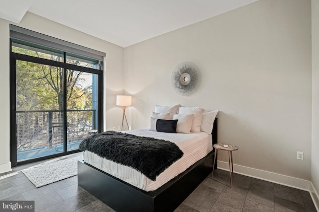 525 Water St SW Unit 319, Washington, DC 20024 - bedroom with baseboards and access to exterior