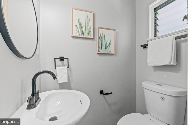 8818 Greens Ln, Randallstown, MD 21133 - half bathroom featuring a sink and toilet
