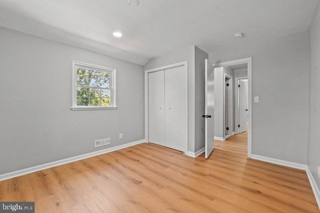 8818 Greens Ln, Randallstown, MD 21133 - unfurnished bedroom with baseboards, light wood-style flooring, a closet, and recessed lighting
