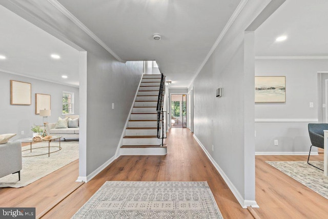 8818 Greens Ln, Randallstown, MD 21133 - staircase with ornamental molding, wood finished floors, recessed lighting, and baseboards