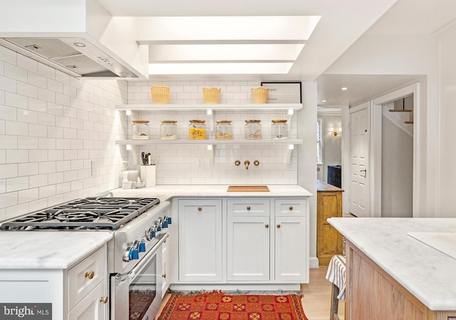 7006 Meadow Ln, Chevy Chase, MD 20815 - kitchen featuring stainless steel stove, open shelves, wall chimney exhaust hood, and tasteful backsplash