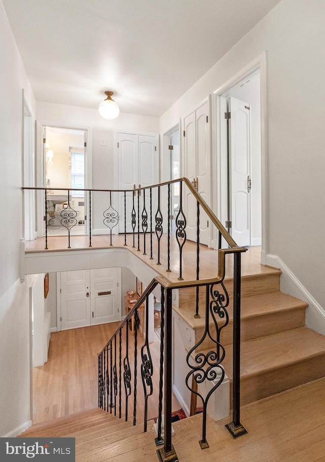 7006 Meadow Ln, Chevy Chase, MD 20815 - stairs featuring wood finished floors and baseboards