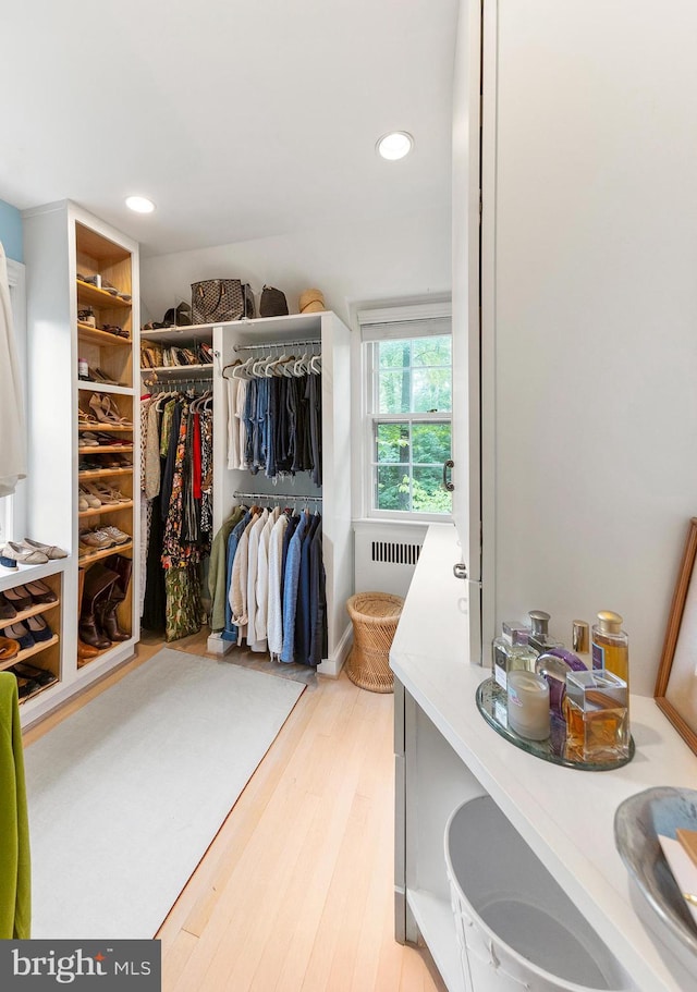 7006 Meadow Ln, Chevy Chase, MD 20815 - walk in closet featuring radiator and light wood-style flooring
