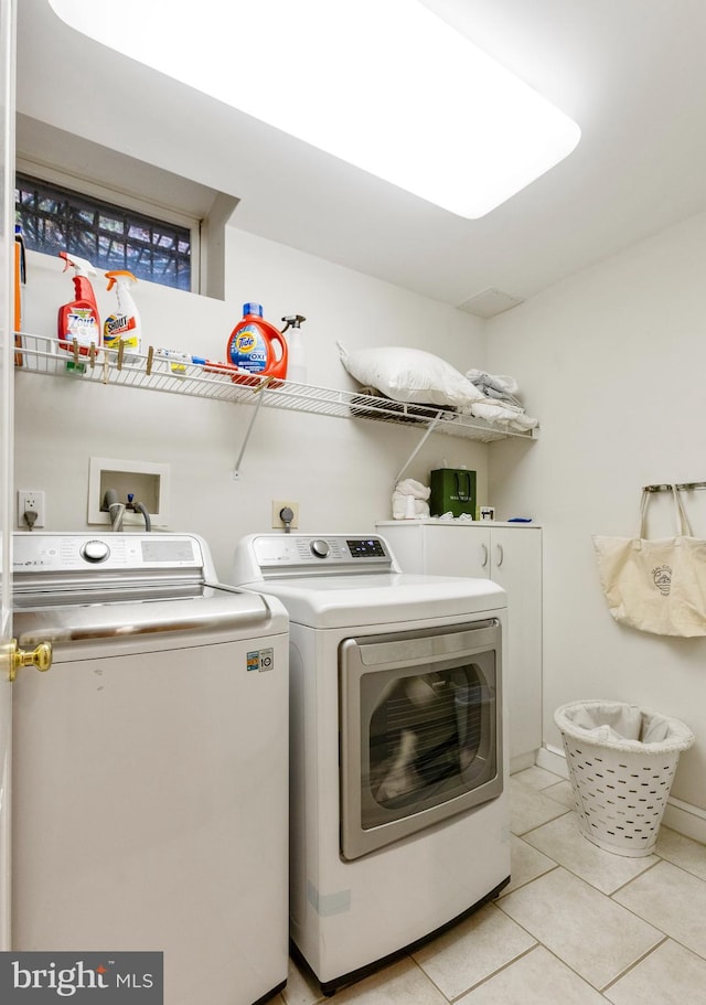 7006 Meadow Ln, Chevy Chase, MD 20815 - washroom featuring washer and dryer and light tile patterned flooring