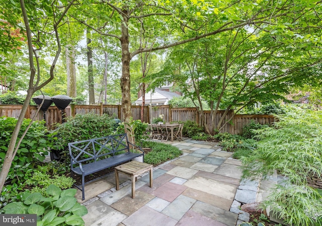 7006 Meadow Ln, Chevy Chase, MD 20815 - fenced backyard featuring a patio and outdoor dining area