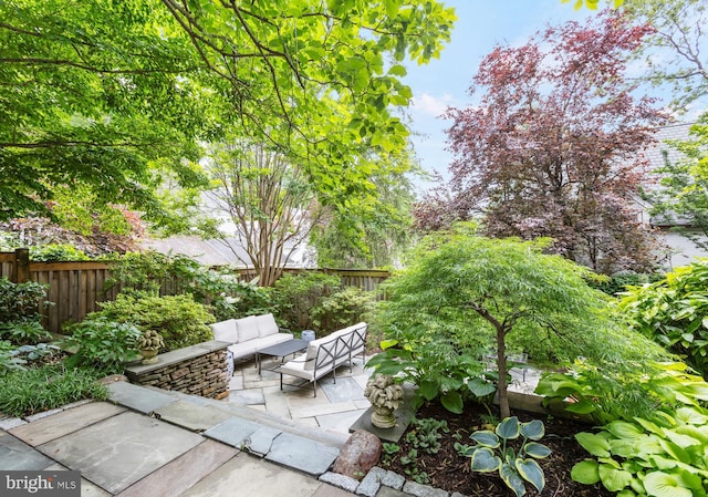 7006 Meadow Ln, Chevy Chase, MD 20815 - fenced backyard with an outdoor living space and a patio