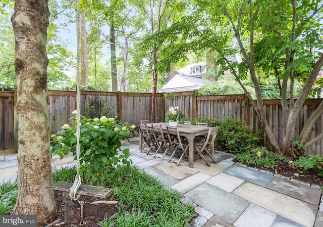 7006 Meadow Ln, Chevy Chase, MD 20815 - fenced backyard featuring a patio and outdoor dining area