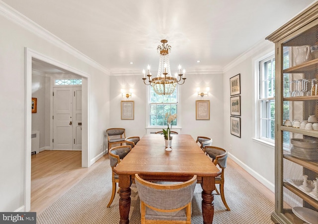 7006 Meadow Ln, Chevy Chase, MD 20815 - dining room with radiator, a chandelier, light wood finished floors, ornamental molding, and baseboards