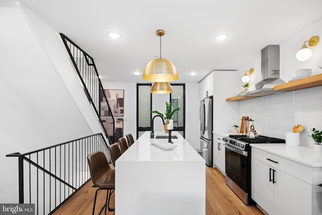 1936-38 E York St Unit 4, Philadelphia, PA 19125 - kitchen with appliances with stainless steel finishes, wall chimney exhaust hood, a sink, open shelves, and tasteful backsplash