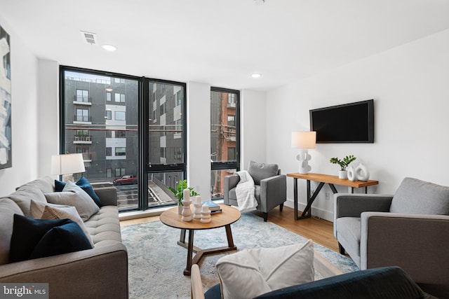 1936-38 E York St Unit 4, Philadelphia, PA 19125 - living room featuring wood finished floors, recessed lighting, floor to ceiling windows, and baseboards