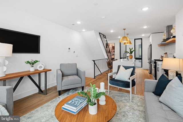 1936-38 E York St Unit 4, Philadelphia, PA 19125 - living room with light wood-style floors, recessed lighting, stairway, and baseboards